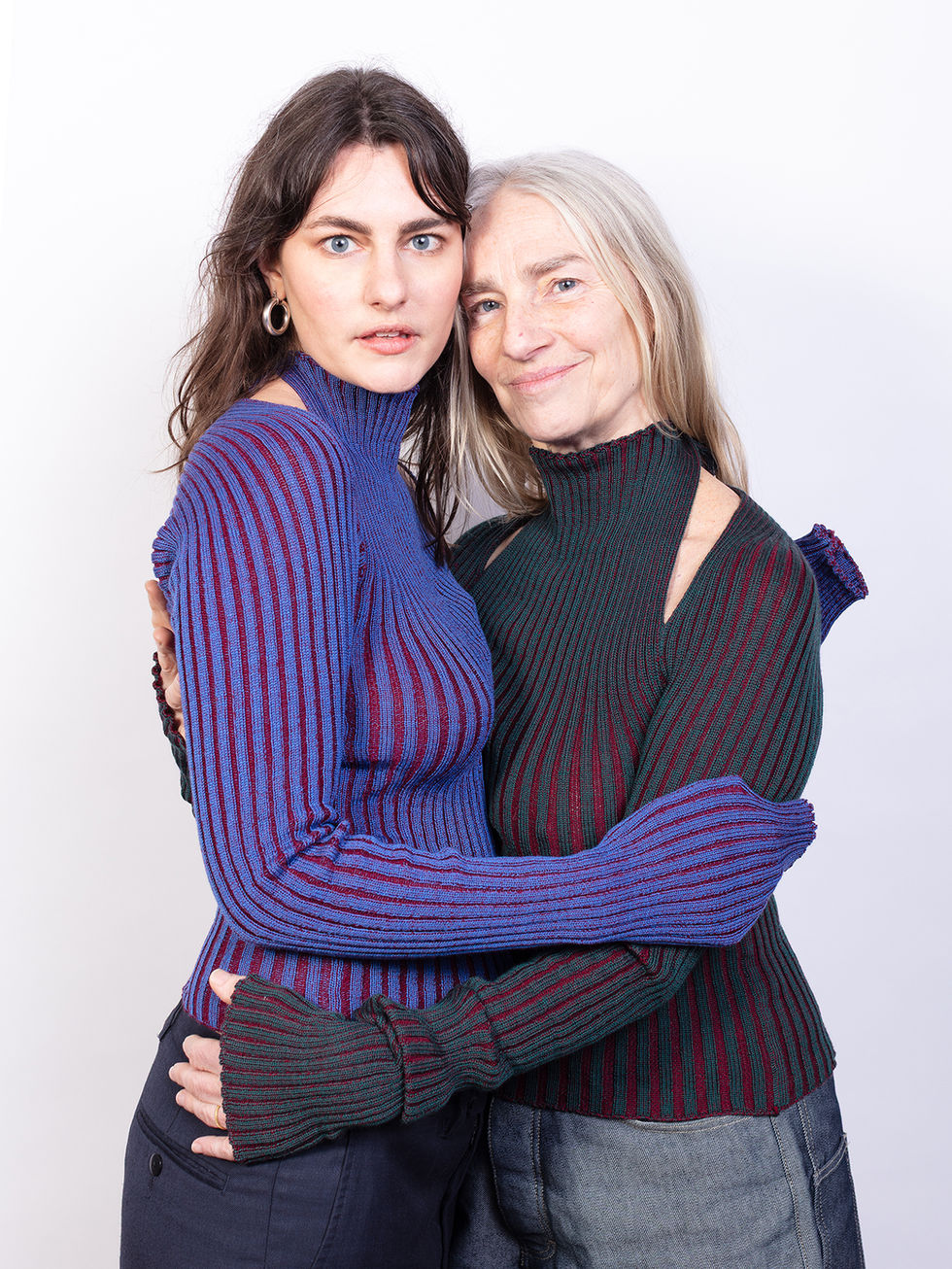 Two models in Y sweaters