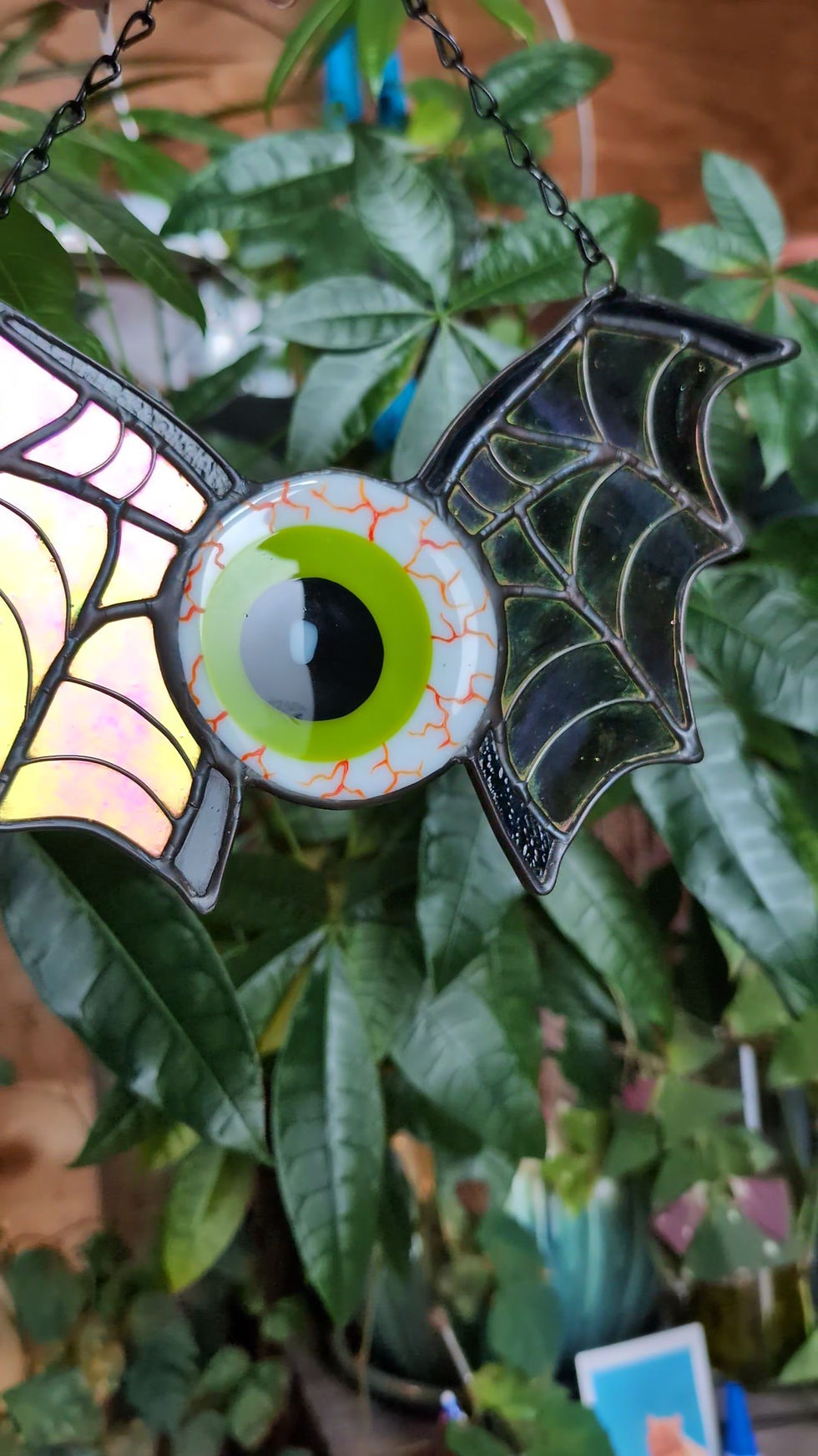 Thumbnail: Bloodshot eyeball Stained Glass Suncatcher with dichroic spiderweb bat wings