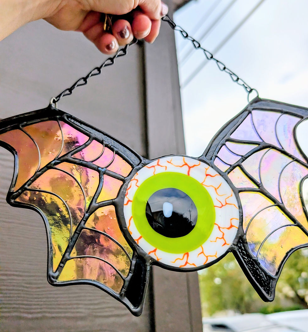 Thumbnail: Bloodshot eyeball Stained Glass Suncatcher with dichroic spiderweb bat wings