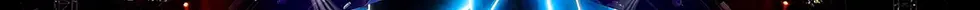 Gigi D'Alessio al pianoforte sul palco illuminato di blu, con maxischermi laterali e il pubblico che riprende il concerto con gli smartphone.