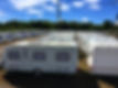 Caravans stored in rows on a sunny day..