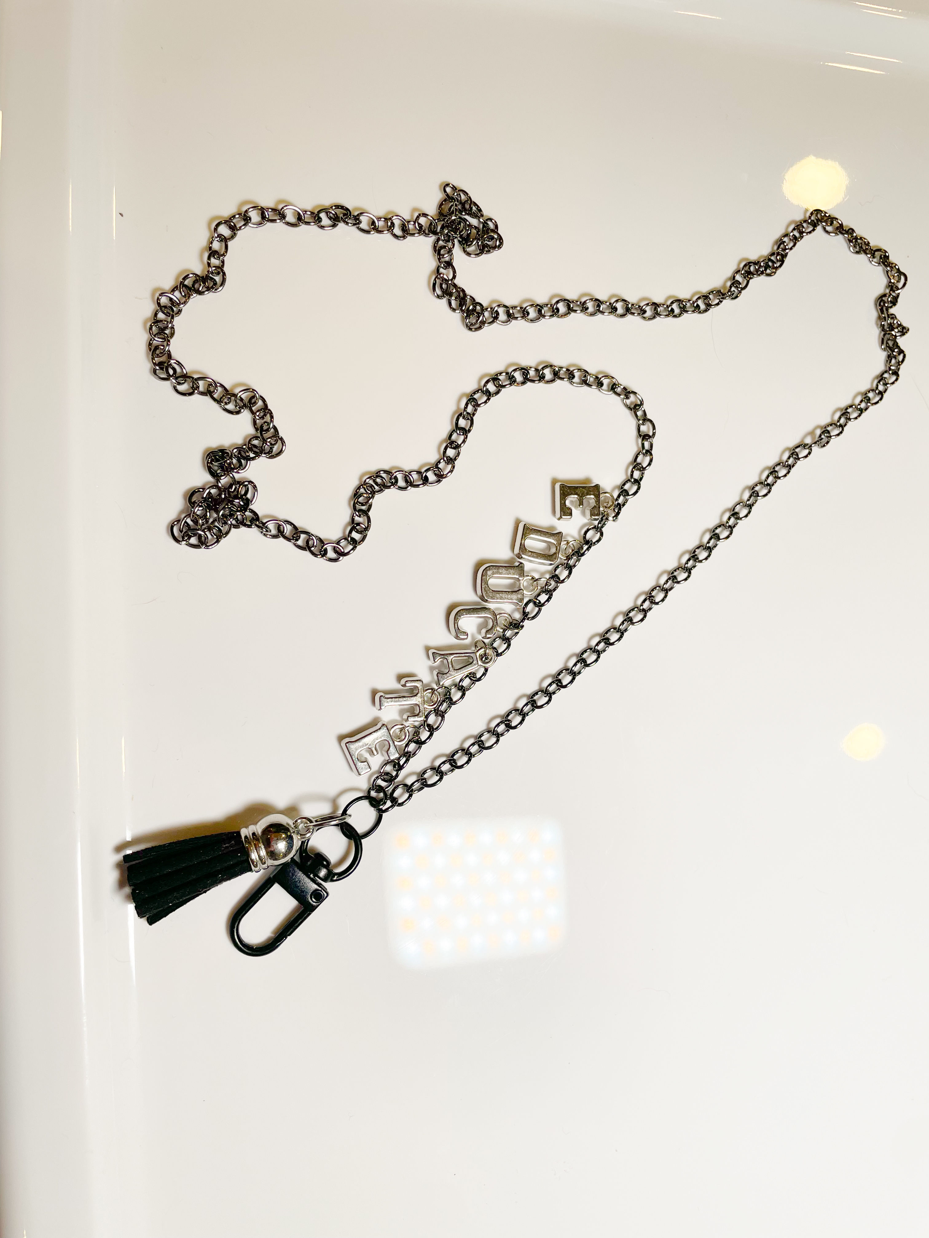 silver and black charm lanyard