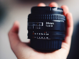 Hand Holding Camera Lens