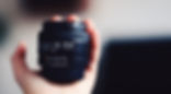Hand Holding Camera Lens
