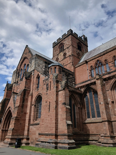The red stone exterior of Carlisle Cathedral 