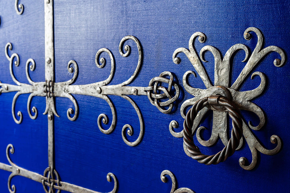 The door to the Great Hall with iron work inspired by Raveningham Church