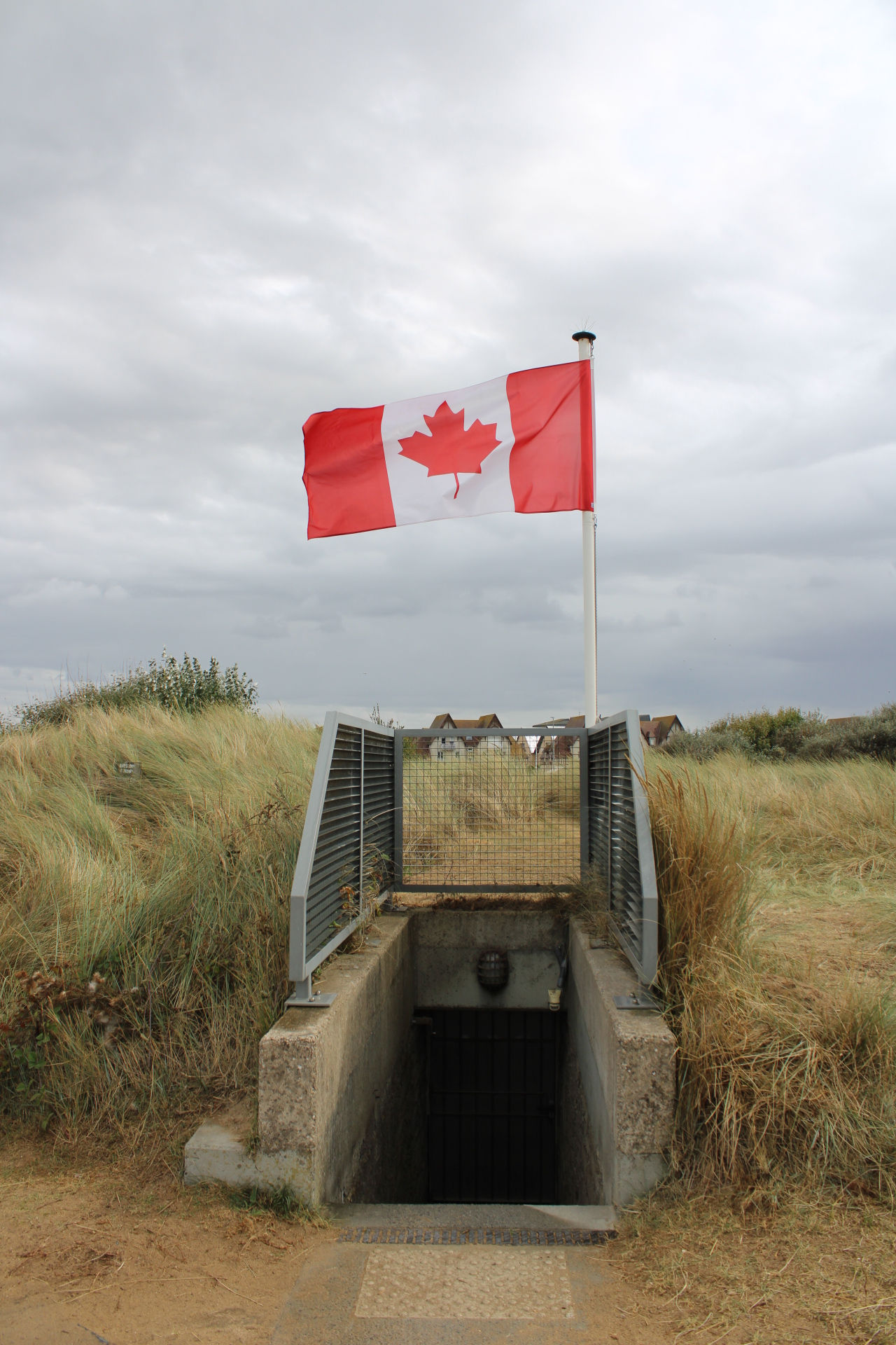 A Canadian flag flies over a German bunker at Juno Beach Centre