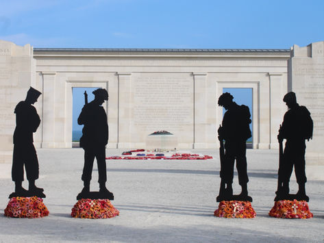 Soldier silhouettes and poppy wreaths in front of The British Normandy Memorial, Ver-sur-Mer