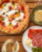 A selection of Crust Bros' signature wood-fired Neapolitan pizzas, showcasing classic favourites and seasonal specials with fresh Italian ingredients and hand-stretched dough.