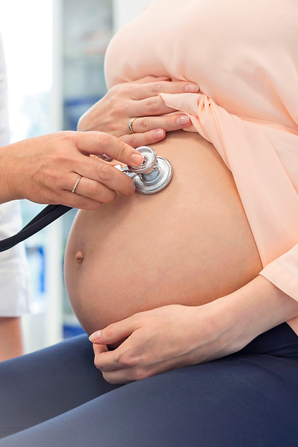 Doctor examining pregnant woman