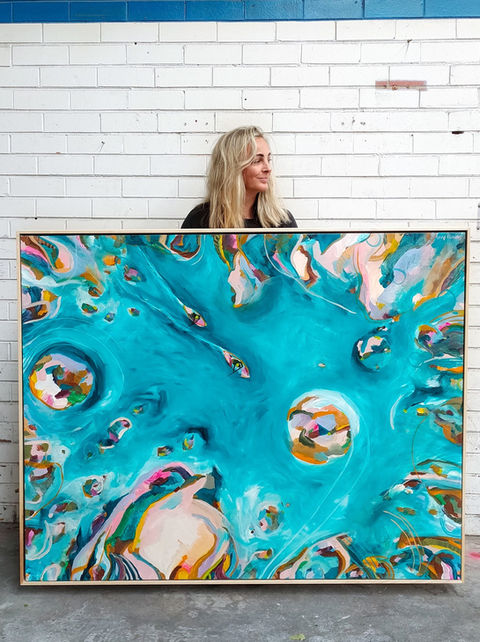 large, blue limited edition print showing paddle borders, swirling ocean and bright, colourful islands.