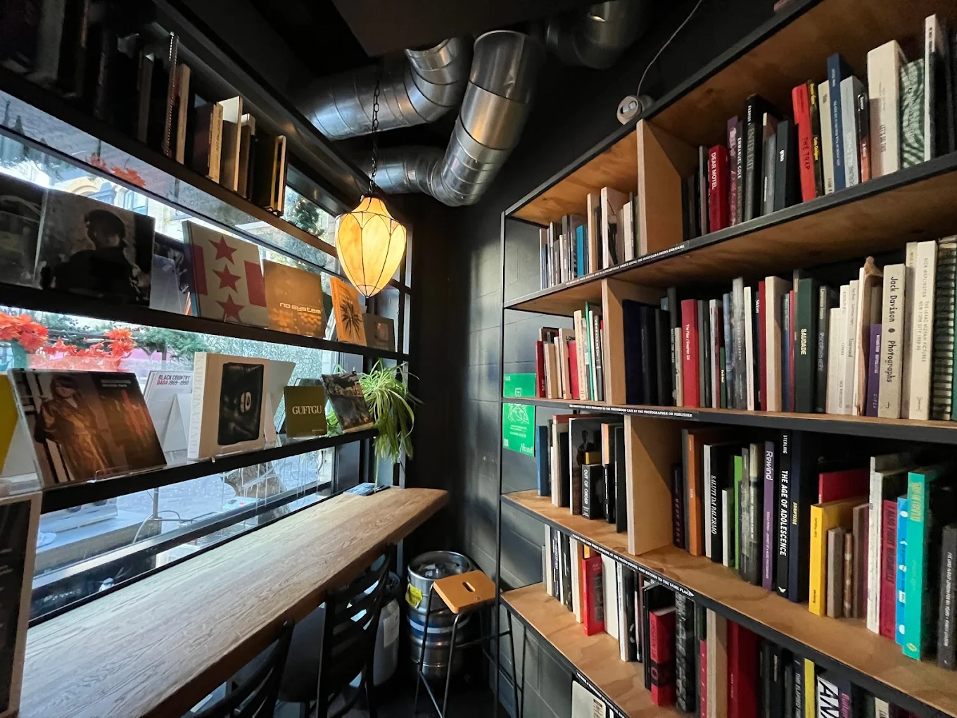 Interior of Photobook Cafe, Shoreditch, featuring photography books and a cosy café workspace.
