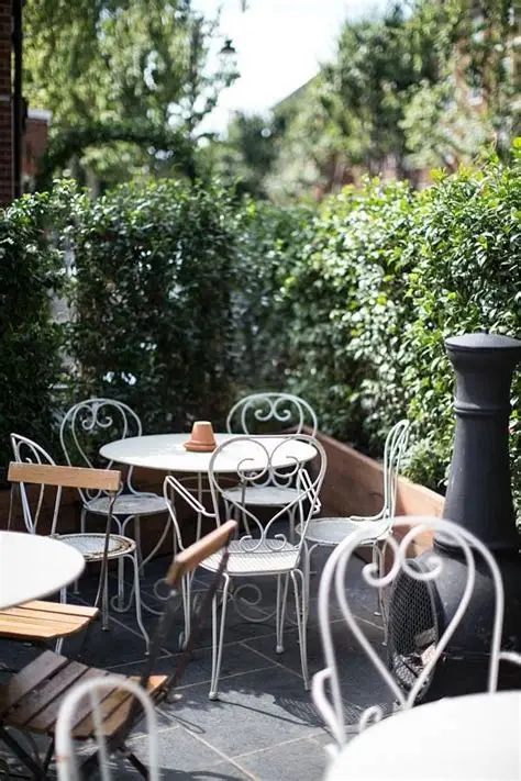 A wine glass filled with red wine, elegantly placed on a table at Temper.