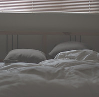 Messy bed and closed blinds_edited.jpg