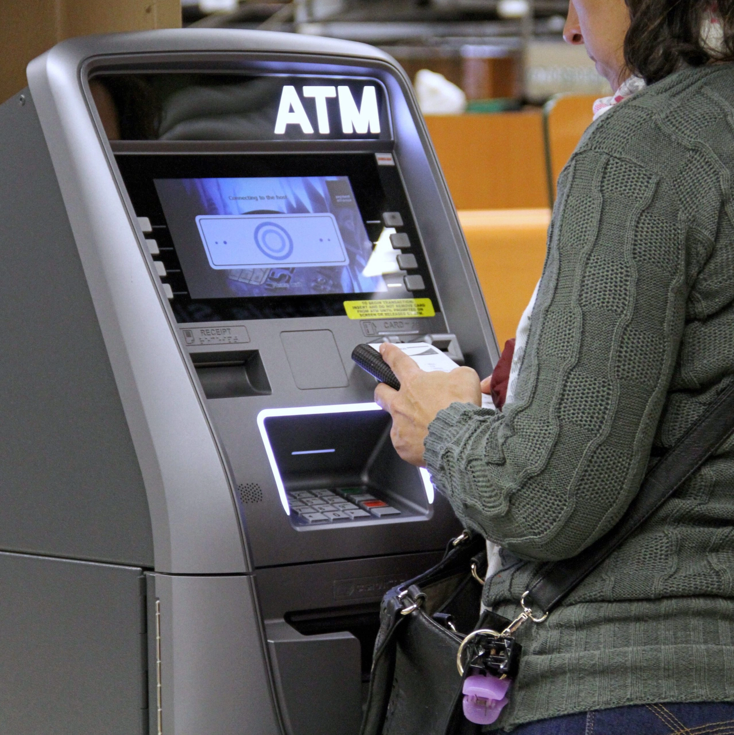 woman-using-atm_t20_goBo9N-edited-scaled.jpg.webp