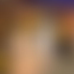 Large lit number "10" surrounded by black, gold, and yellow balloons. Background features wood paneling and a "STEEL SMILING" sign.