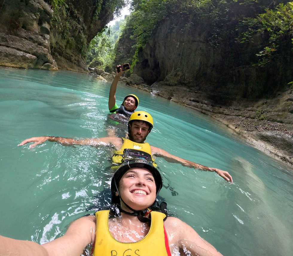 Our guide doing the most- taking photos while swimming us through the pools