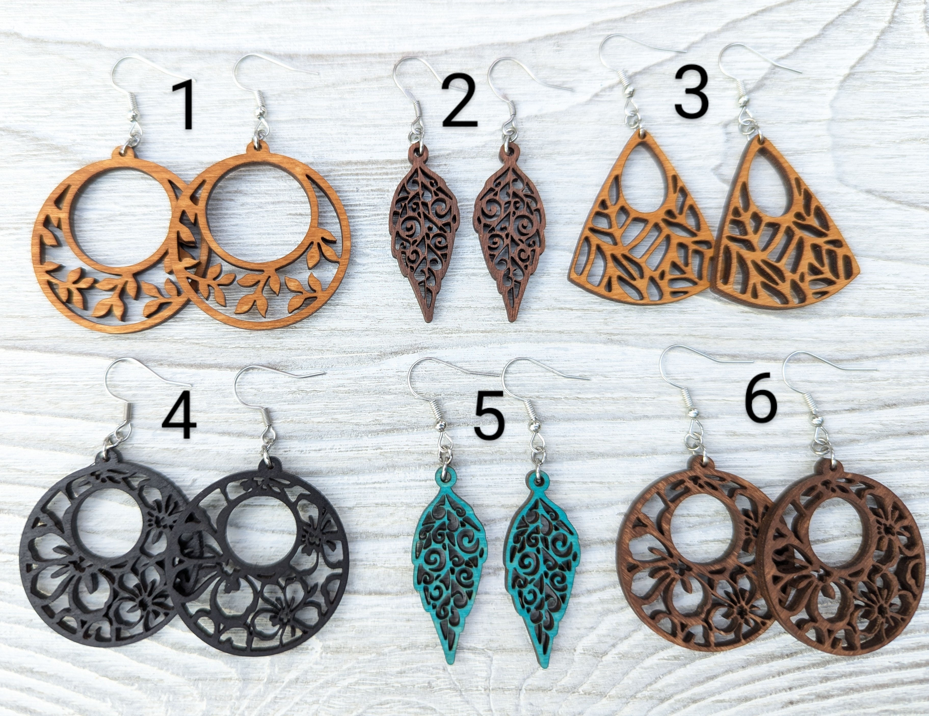 Elevate your style with these stunning handcrafted dangle earrings. Each pair is made from lightweight wood and meticulously