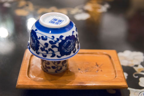 Blue and white porcelain  cups on a wooden tray