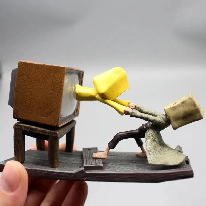 Thumbnail: Figurine of Little Nightmares characters, pushing and pulling from a TV.