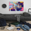 Thumbnail: Colorful Goku art on wall, messy bed, backpack, clock, cords, and controller.