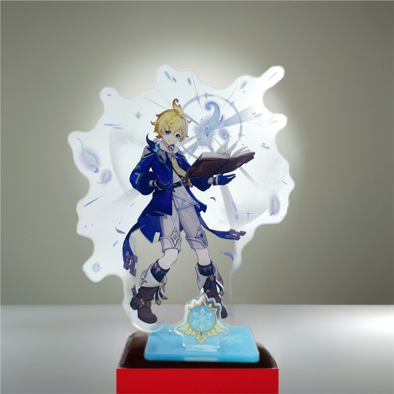 Anime character figure with blue clothing, holding book, standing on a red stand.