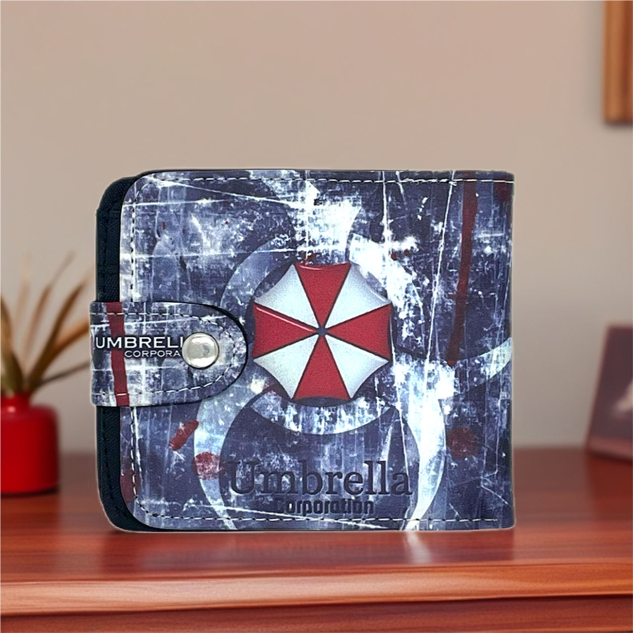Resident Evil Umbrella Corp logo wallet on a wooden table, close up shot