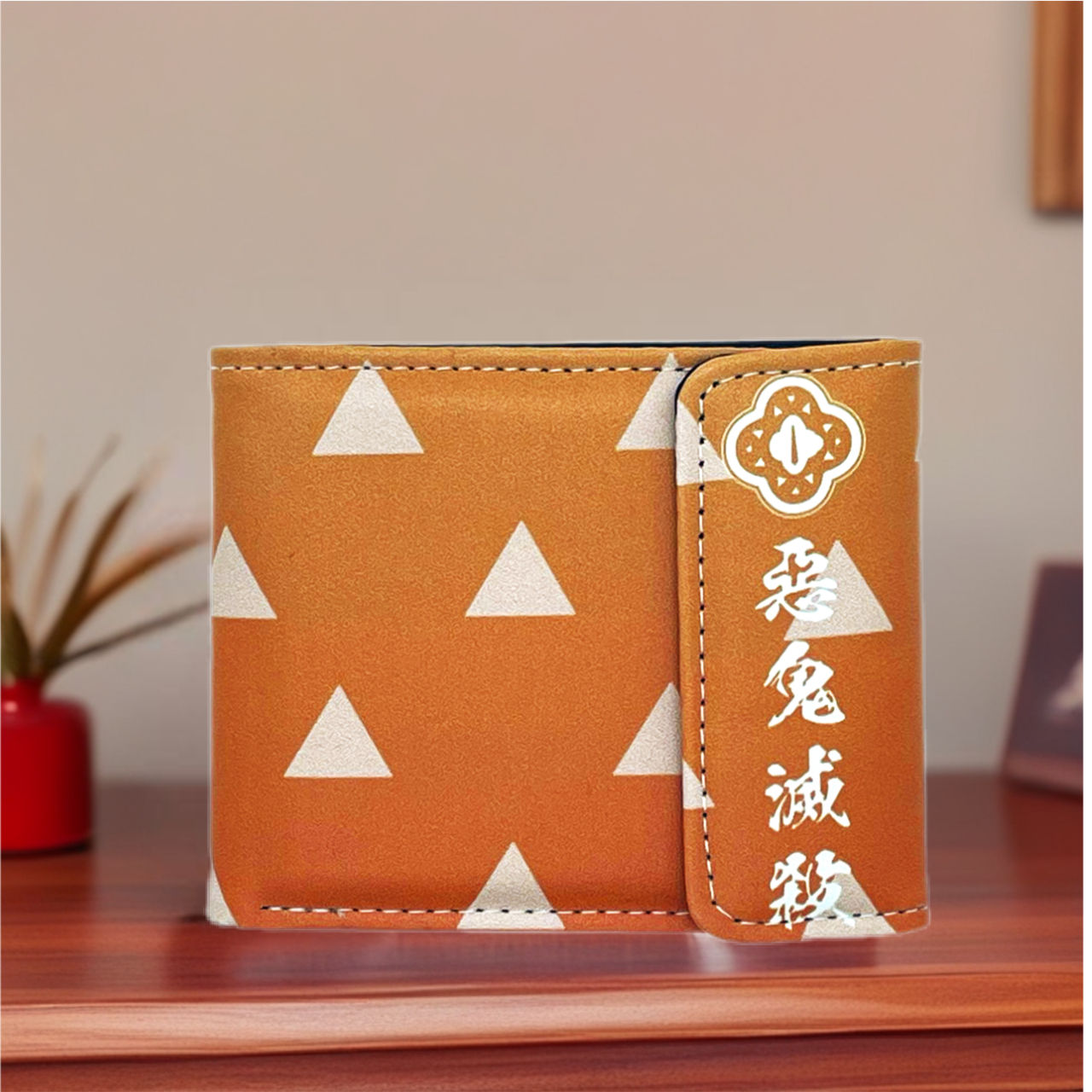 Tan wallet with white triangles and Japanese text, close-up shot.