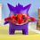 Thumbnail: Purple Gengar figure wearing a colorful mask, standing on a yellow surface.
