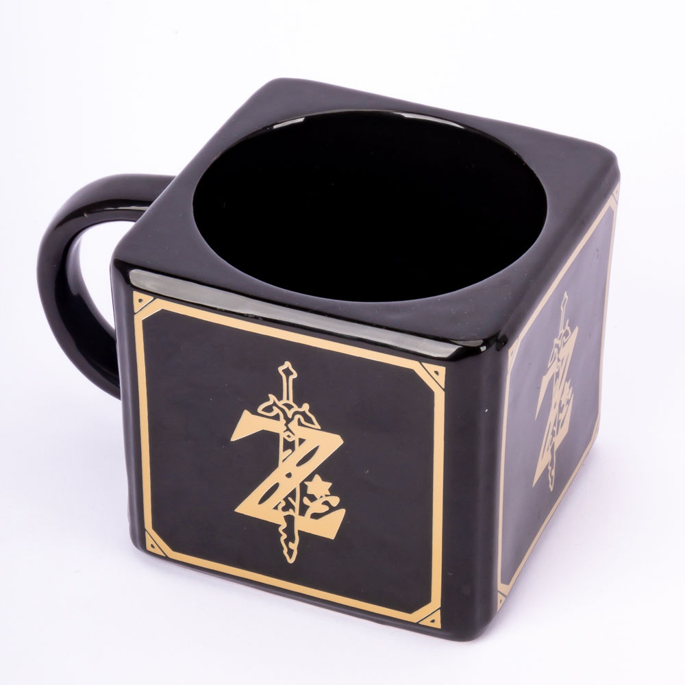 Black Zelda mug with gold accents and the iconic logo on display