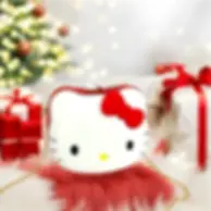 White Hello Kitty purse with a red bow, surrounded by Christmas gifts.