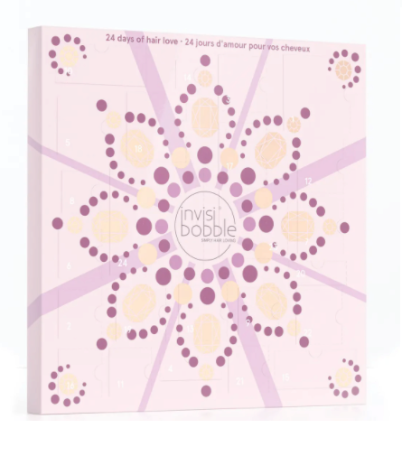 The Invisibobble advent calendar is a pale pink with peach and purple dots in a festive star shape
