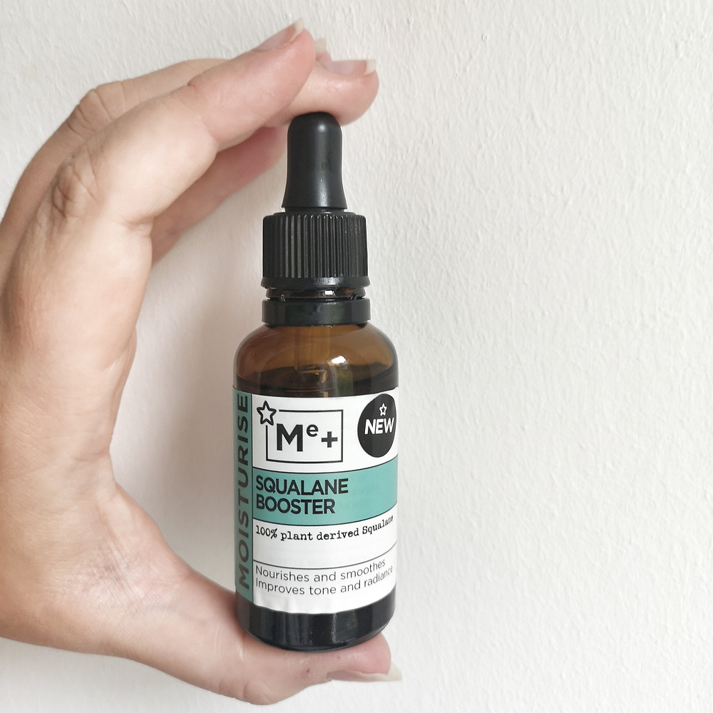 Hand holding Superdrug's Squalene Booster Oil