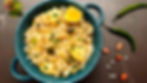 Shravan Sabudana Khichdi - Method 12 -A bowl with sabudana khichdi, lemon wedge, and coriander. Green chilies and peanuts on the side.