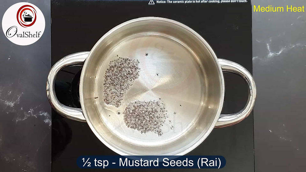 Preparing Kacche Aam Ki Kadhi - tempering
