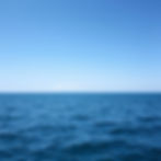 ocean calm water with horizon.jpg