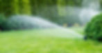 irrigation system sprinklers on grass