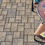 Thumbnail: A top down view of a concrete patio using a three piece slab set with a stone cleft top to mimic natural stone. Color is tan