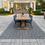 Thumbnail: Techo Bloc Blu 60 Smooth Paver Slab shown as an outdoor patio with a contrasting accent color under an outdoor dining set