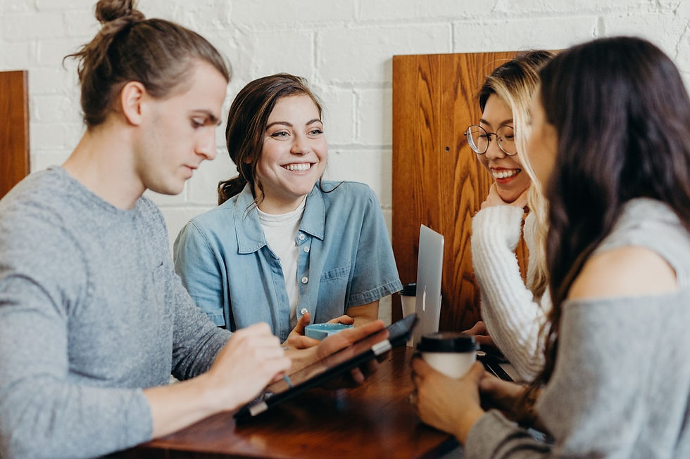 Students sitting together planning a campaign at a table
