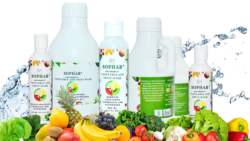 A lineup of SOPHAB® Vegetable and Fruit Wash bottles in various sizes is displayed with fresh produce like lettuce, bananas, grapes, pineapple, and tomatoes in the foreground, and a splash of water in the background, highlighting the product's purpose of safely cleaning fruits and vegetables.