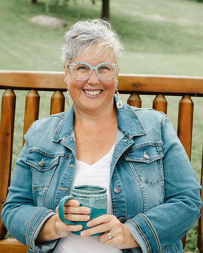 Sara Smith smiling on a bench