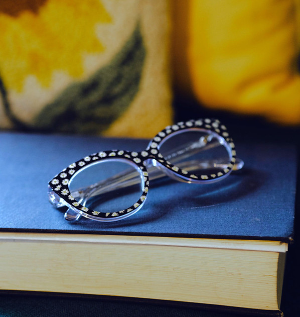 Flowered glasses on a blue chair