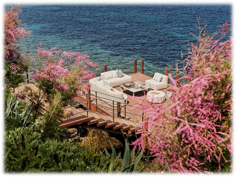 Seafront villa surrounded by lush Mediterranean landscaping in Bodrum.