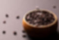 high-angle-close-up-view-fresh-chocolate-chips-wooden-bowl-against-colored-background-unal