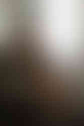 Unedited self-portrait in black lingerie with studio lighting