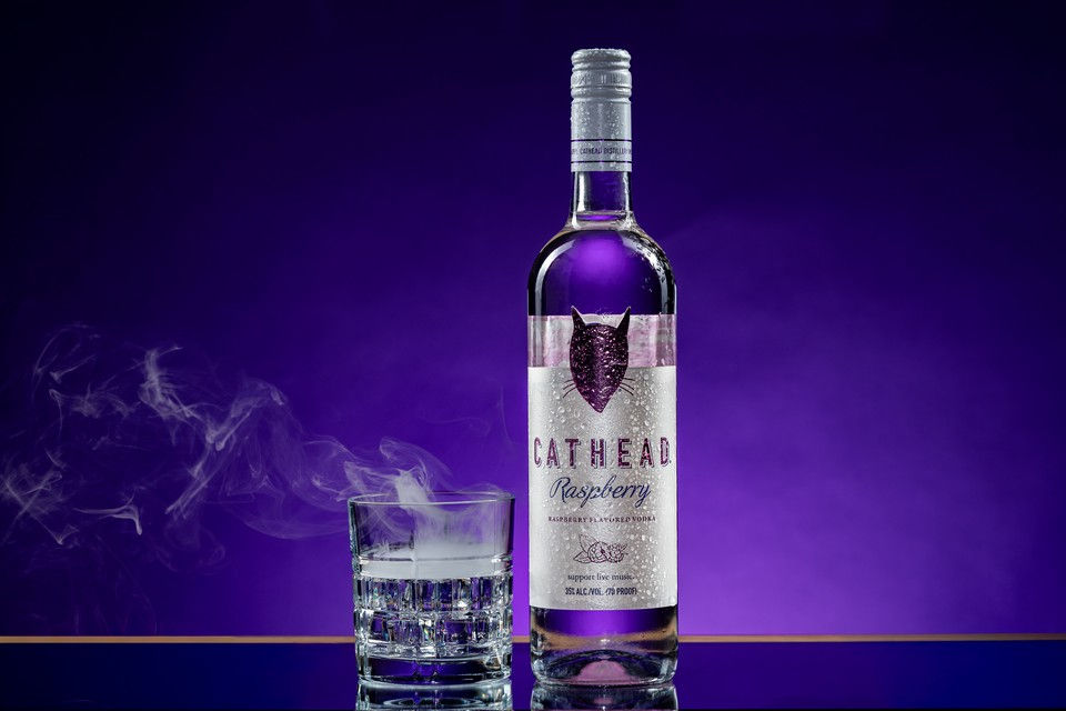 Luxury spirits photography of Cathead Vodka with a smoking cocktail, styled and photographed in a Bi