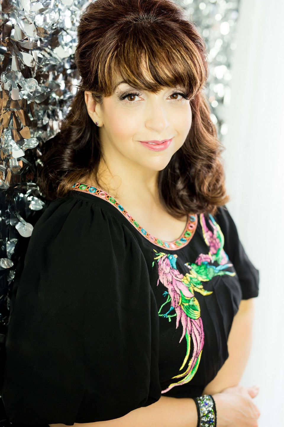 Empowering glamour portrait featuring a radiant woman during a full pampering photography experience