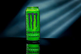 Green Monster Energy can photographed with dramatic hard light and graphic shadows.