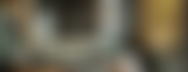 This image presents a perfect example of luxury and sophistication in modern bathroom design. The dark green marble floors and walls, combined with gold-plated fixtures, give the space an elegant and opulent atmosphere. The large mirror with integrated lighting makes the area appear more spacious and bright, while the dark wood cabinetry adds warmth and depth. The minimalist design elements in the bathroom complement the space in a modern and refined manner. The gold accents create a luxurious ambiance, while the quality of the materials used adds timeless elegance to the bathroom. This design demonstrates how functional and aesthetic elements can be flawlessly combined to create a space that exudes both luxury and modernity.